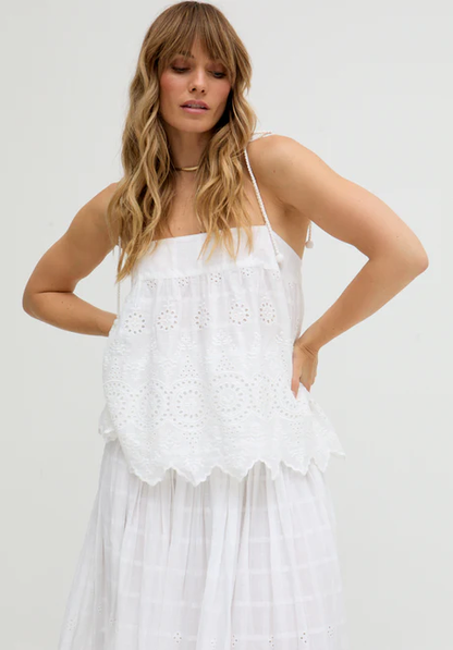 White Ruffled Waist Embroidered Midi Skirt Our embroidered midi skirt features traditional embroidery and cutout detailing.
