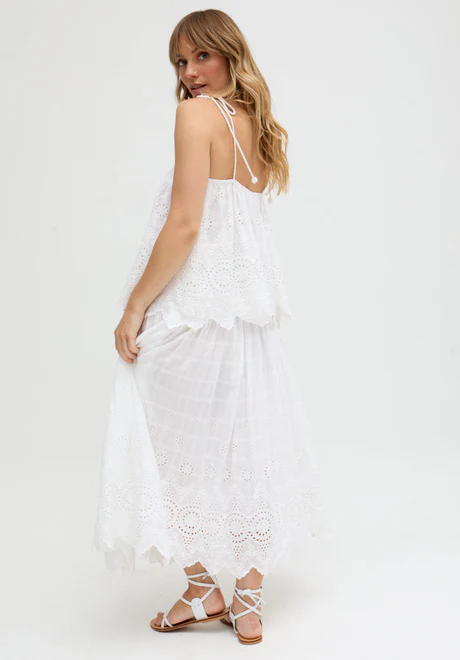 White Ruffled Waist Embroidered Midi Skirt Our embroidered midi skirt features traditional embroidery and cutout detailing.